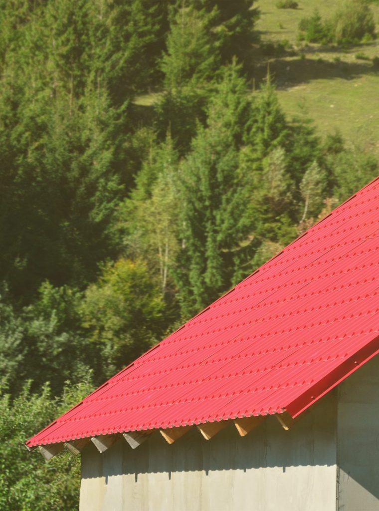 House with a roof made of solid metal sheets, shaped like an old tile